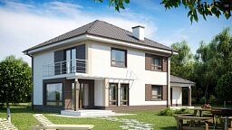 Комфортабельный двухэтажный дом традиционной формы с гаражом.